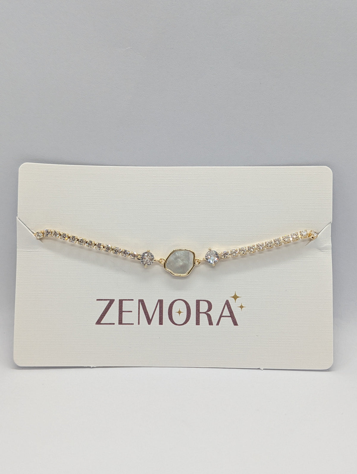 Mother of Pearl Hexagon CZ Tennis Bracelet - Gold tone on Zemora card display