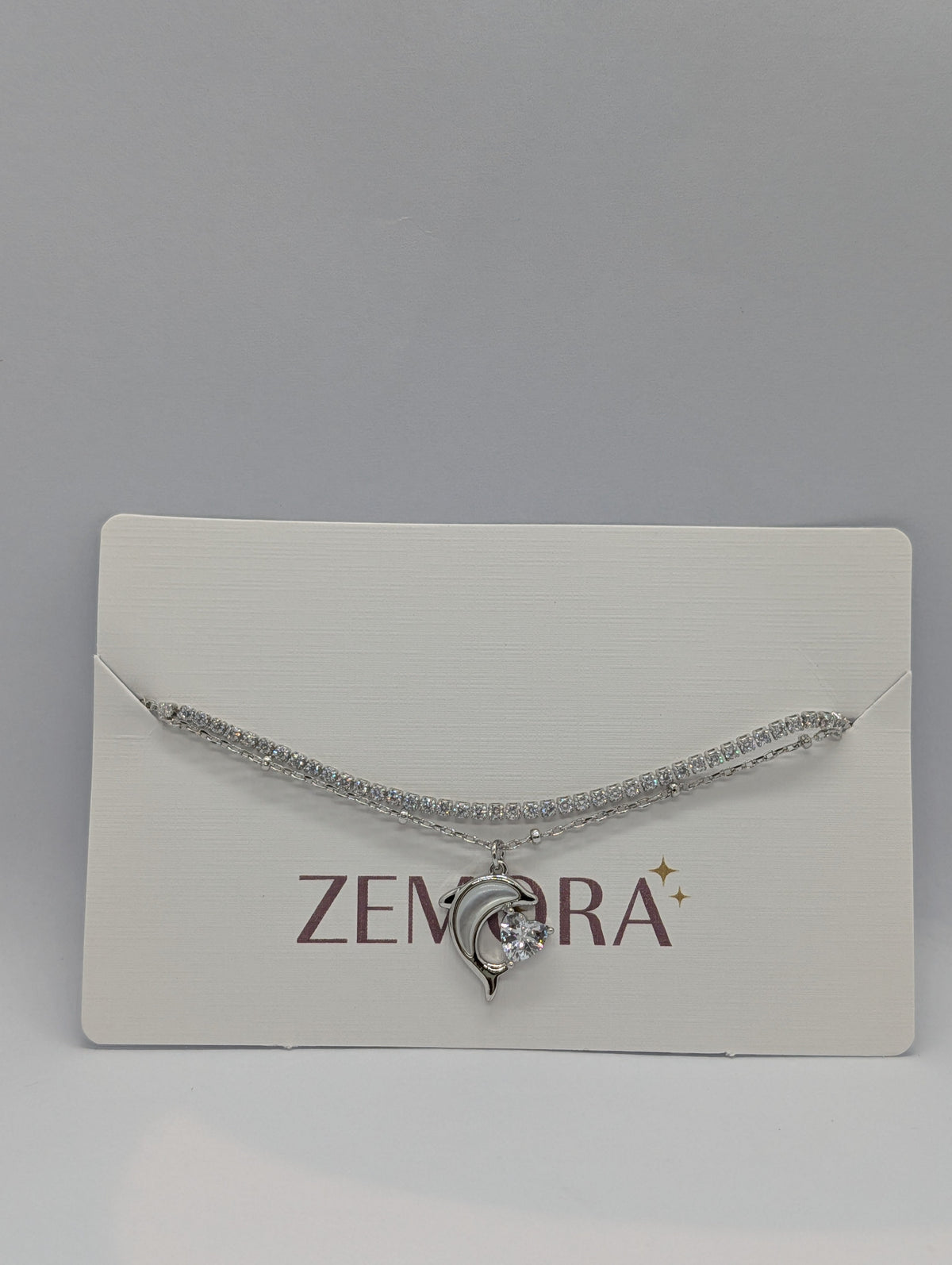 CZ Dolphin Charm Double Layer Bracelet - Silver tone on Zemora card display