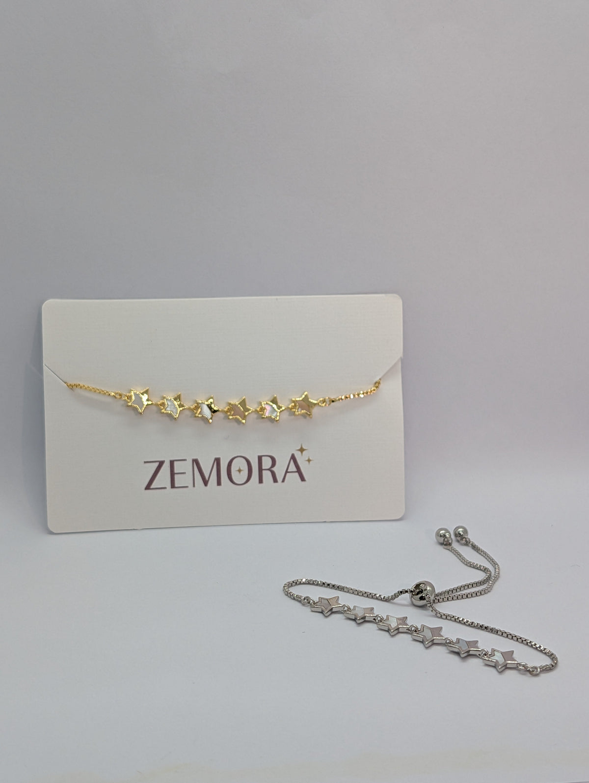 Mother of Pearl Open Star Station Bracelet - Gold and Silver tone both versions on Zemora card display