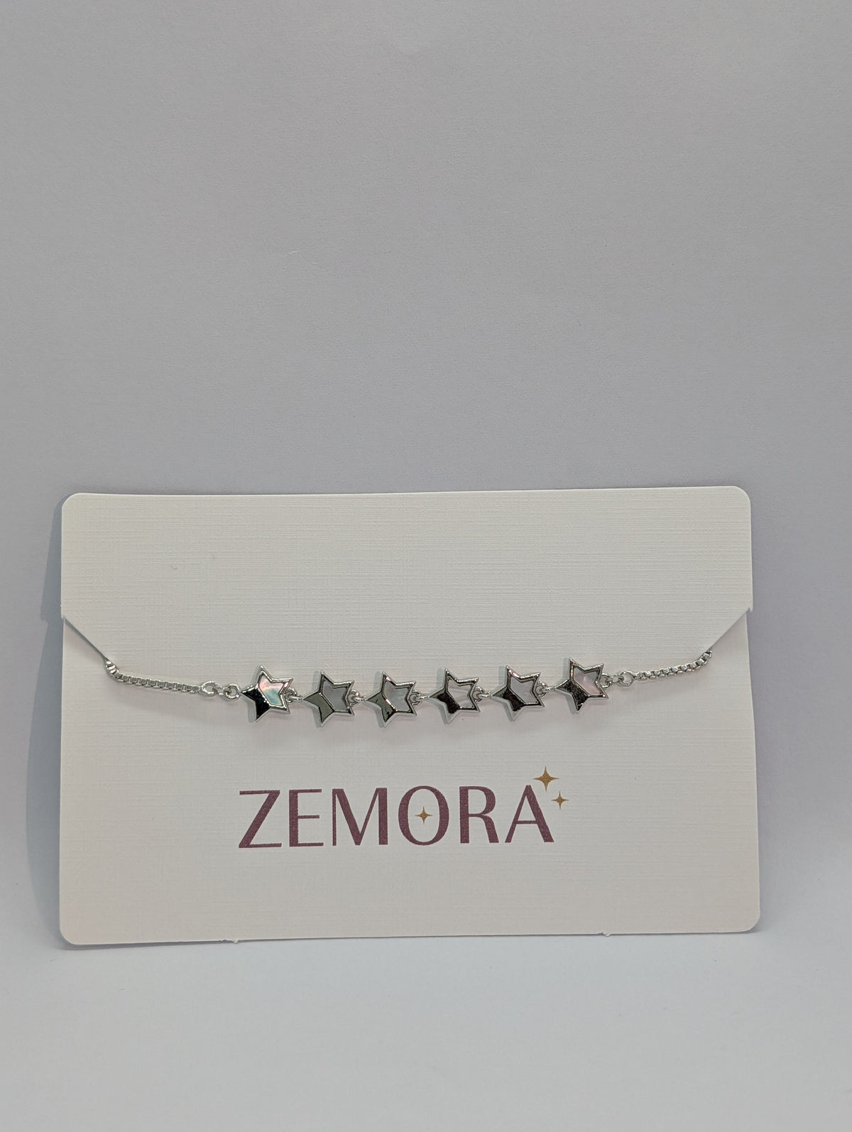 Mother of Pearl Open Star Station Bracelet - Silver tone close up on Zemora card display