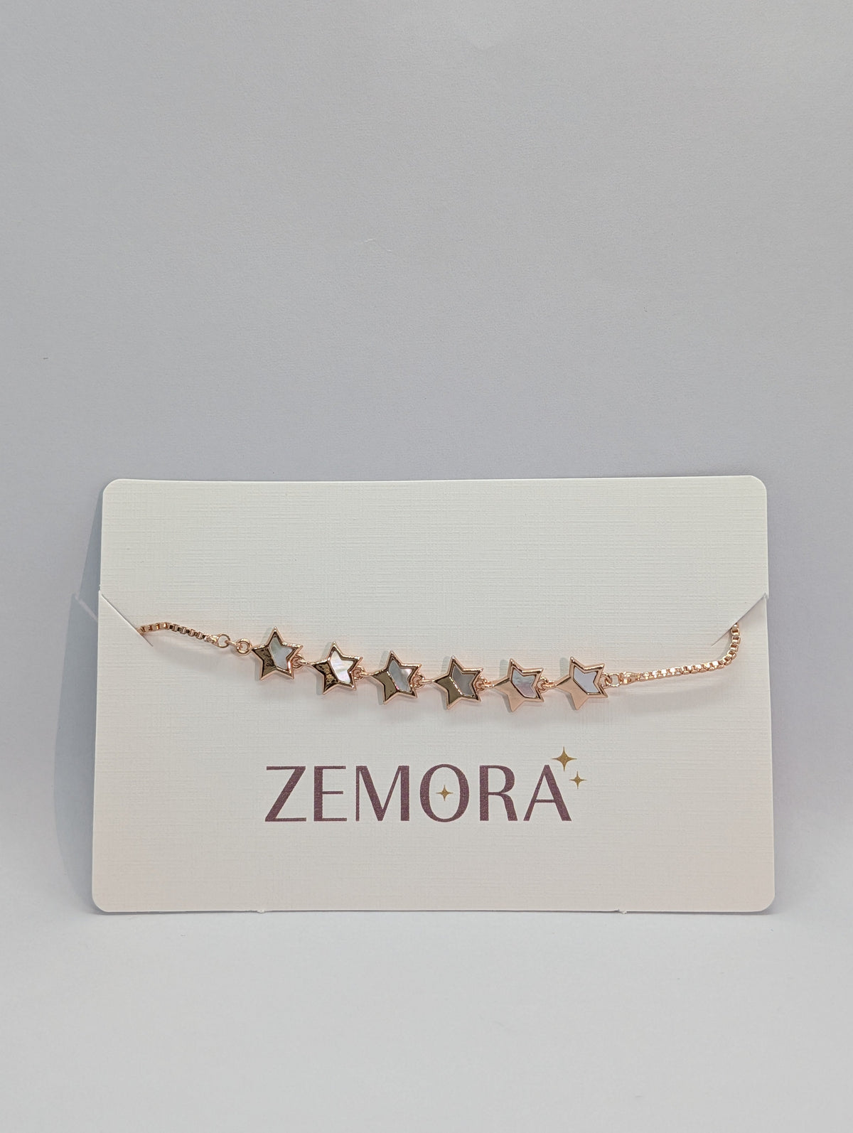 Mother of Pearl Open Star Station Bracelet - Rose Gold tone on Zemora card display