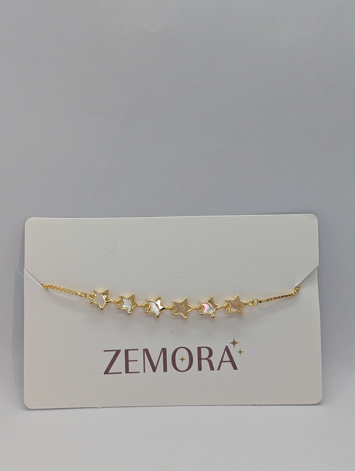 Mother of Pearl Open Star Station Bracelet - Gold tone on Zemora card display