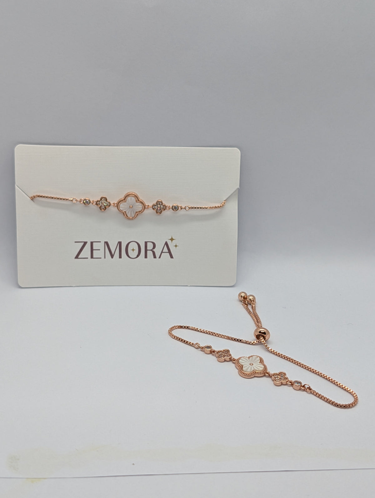 Rose gold mother of pearl clover bracelet with adjustable slider on Zemora card