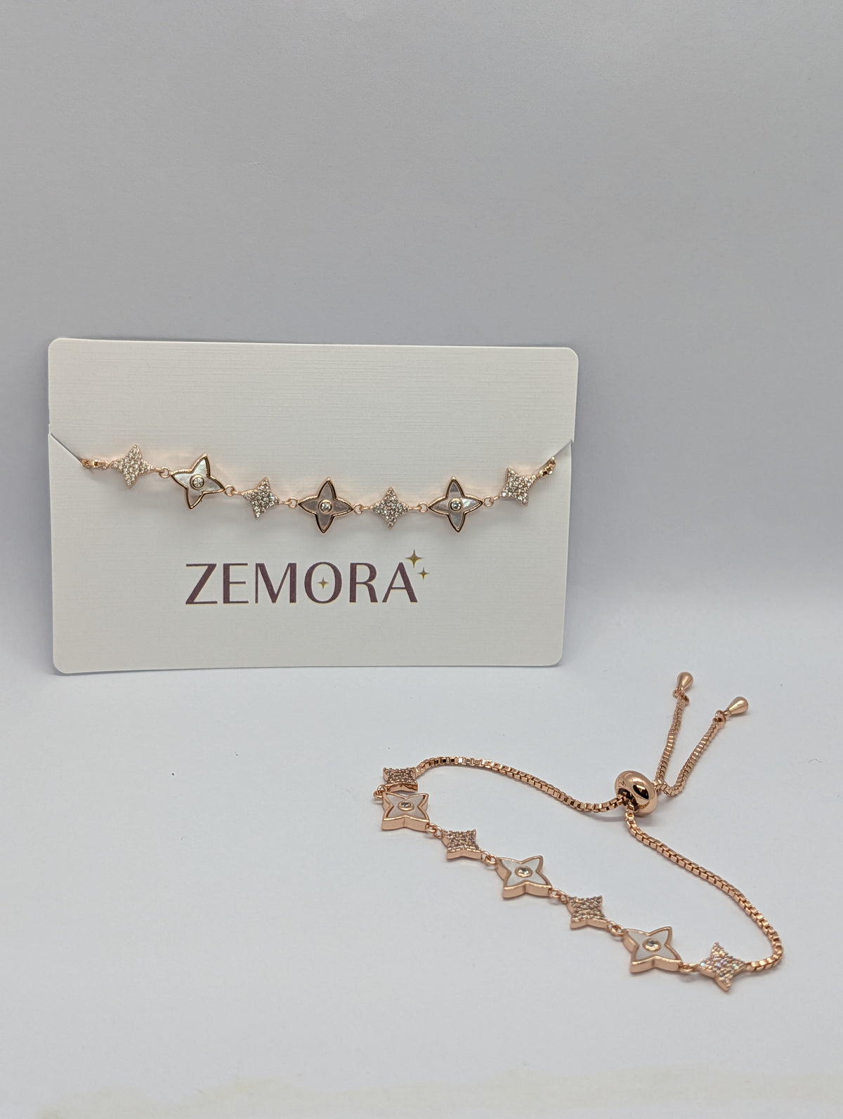 Yellow gold CZ pavé star charm station adjustable bracelet on Zemora jewellery card