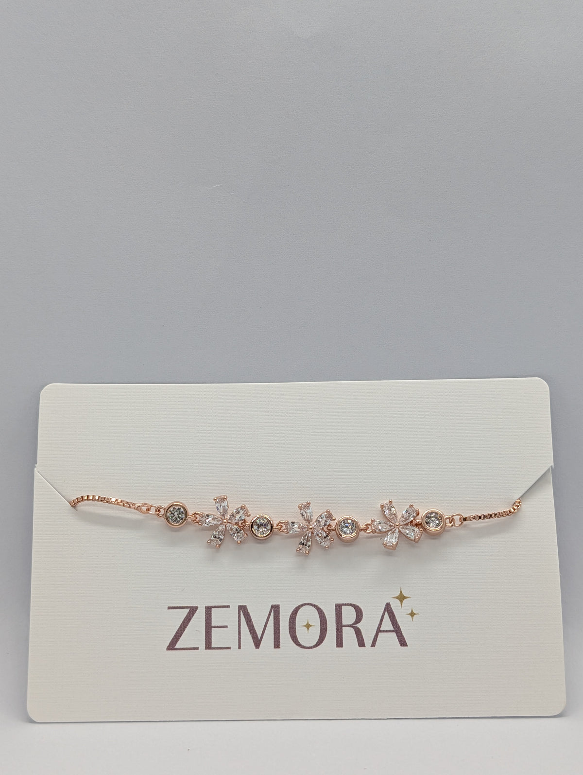 Silver CZ marquise flower bezel station adjustable bracelet on Zemora jewellery card