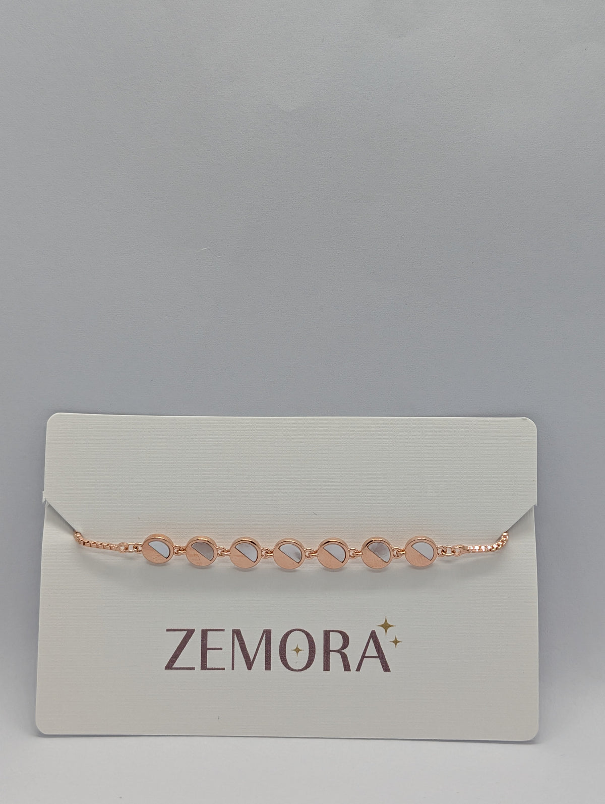 Rose gold mirror disc station adjustable bracelet on Zemora jewellery card