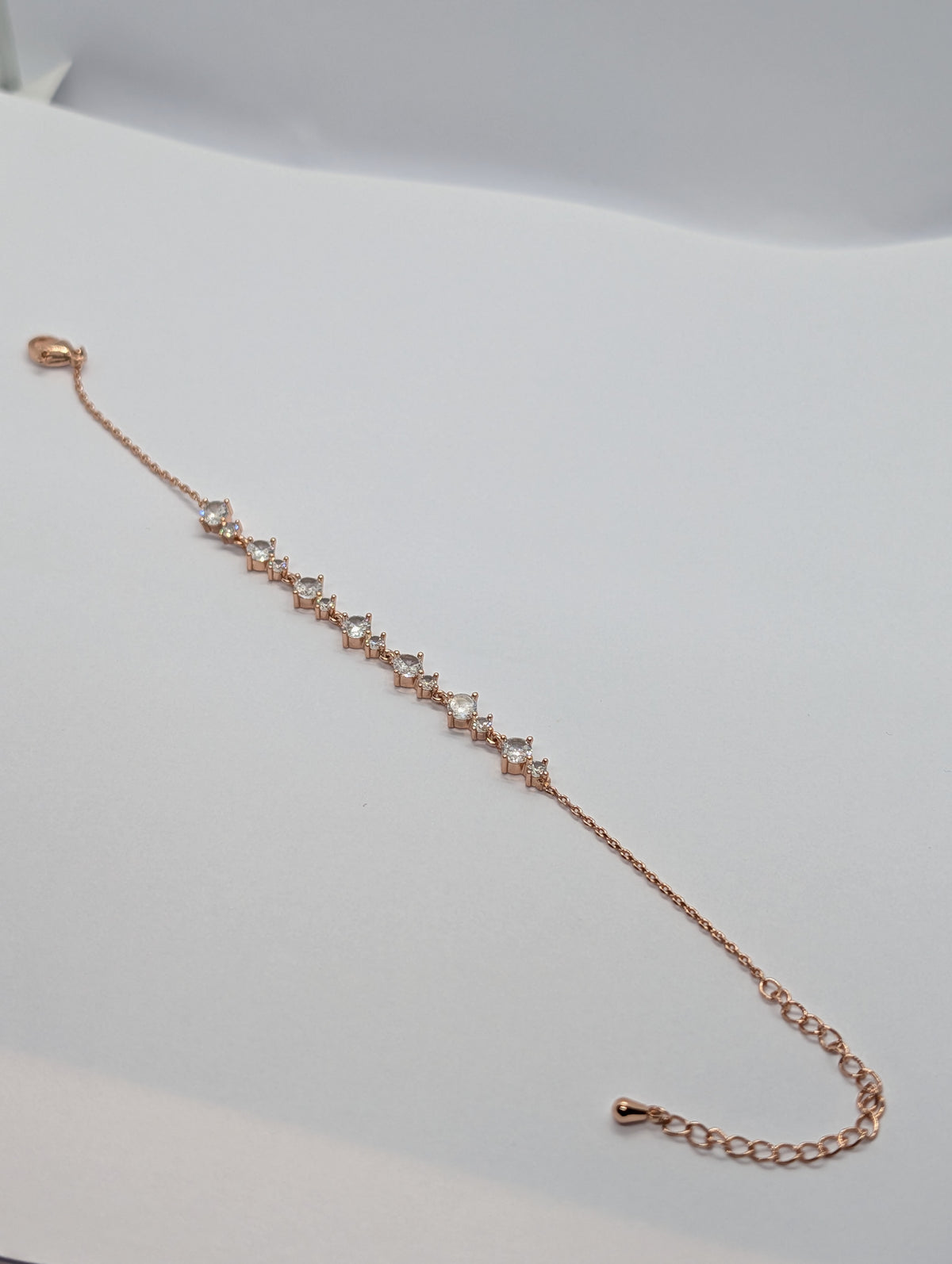 Yellow gold alternating marquise and round CZ station bracelet on Zemora jewellery card