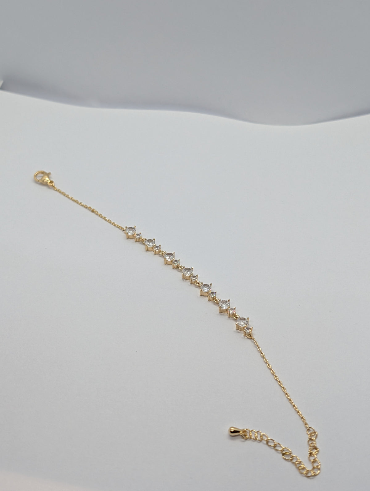 Rose gold alternating marquise and round CZ station bracelet on Zemora jewellery card