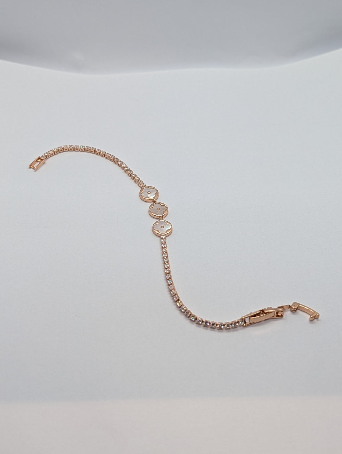 Silver dual-tone pearl clover trio CZ tennis bracelet on Zemora jewellery card