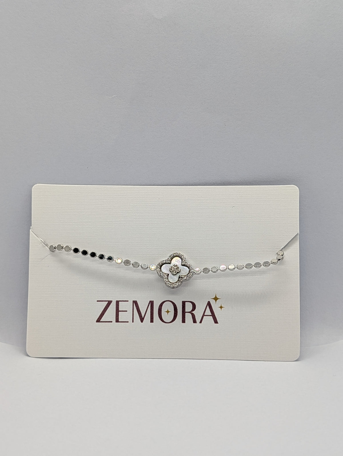 Rose gold pearl clover charm sequin chain bracelet flat lay showing full length and lobster clasp