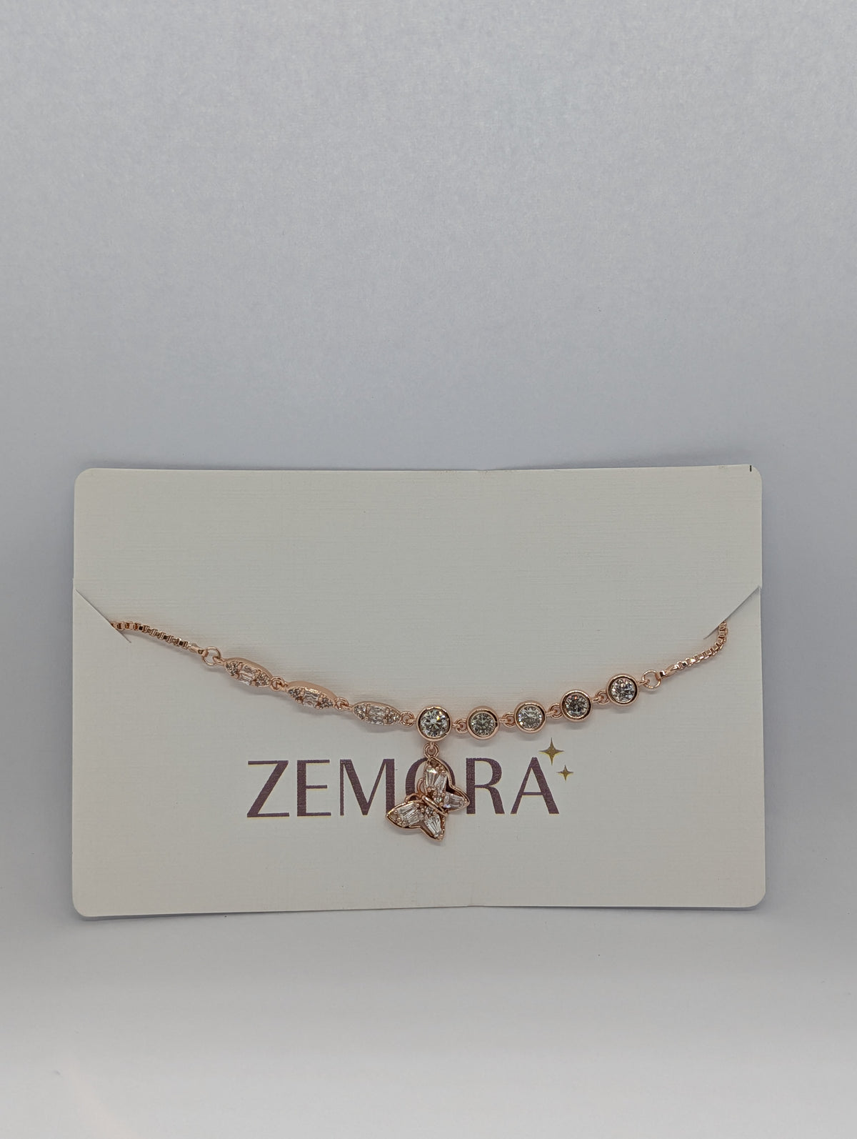 CZ Butterfly Charm Bracelet - Rose Gold tone on display card