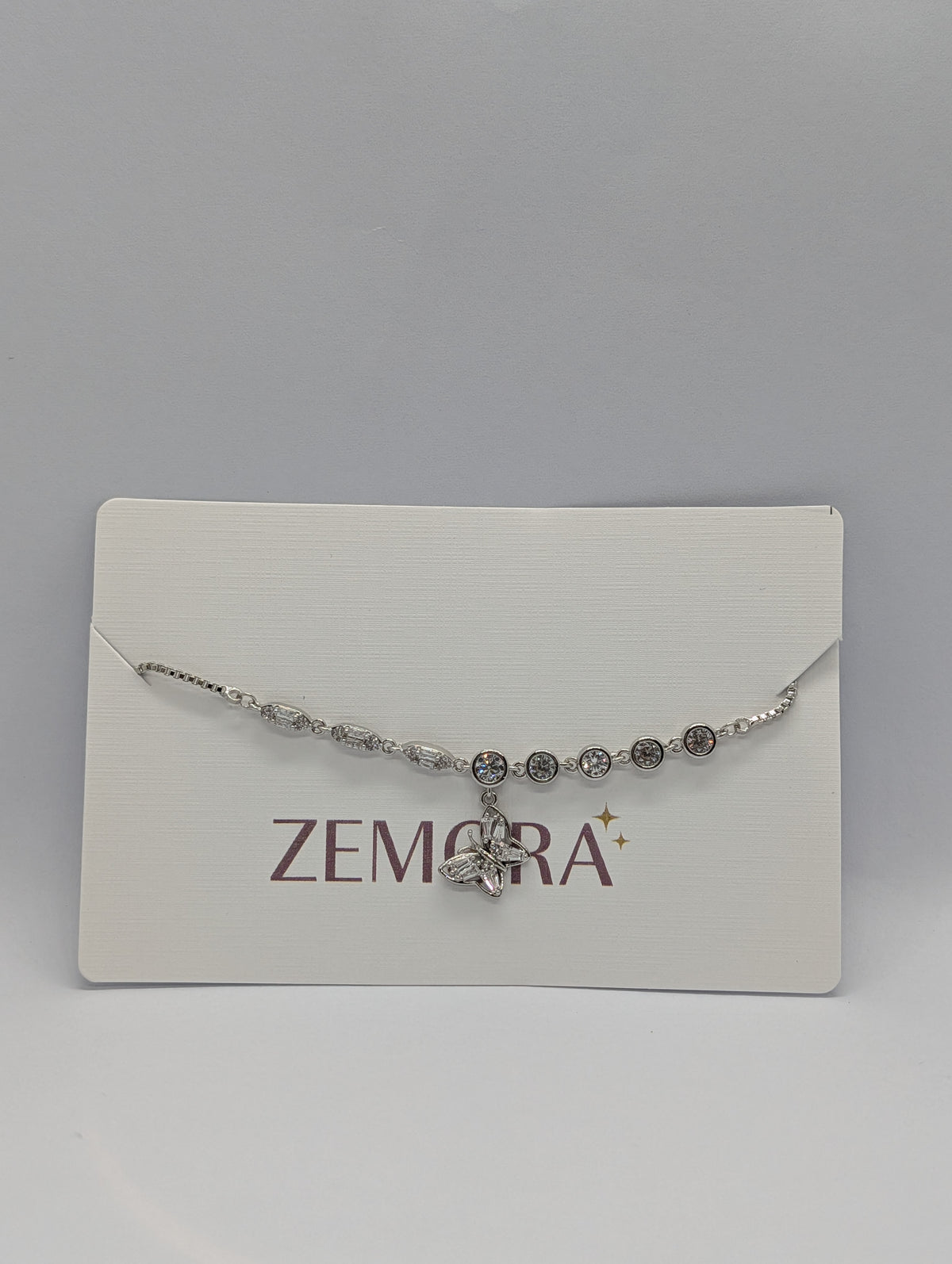 CZ Butterfly Charm Bracelet - Silver tone on display card