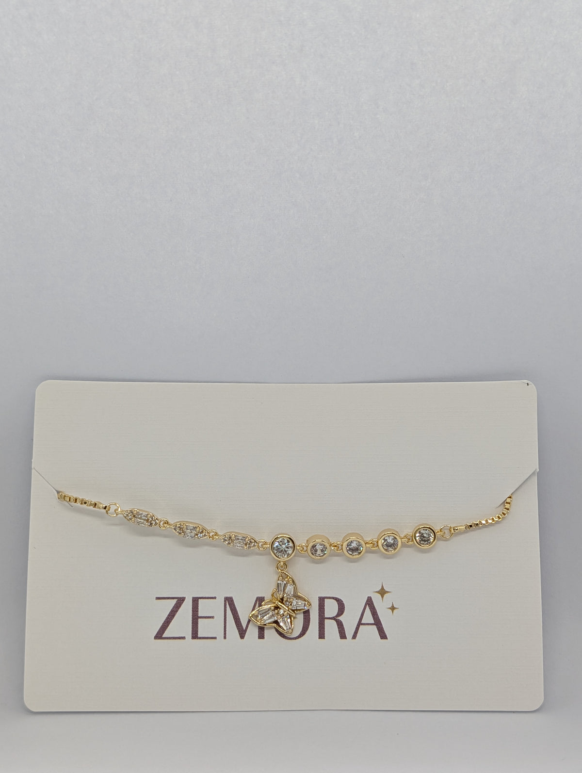 CZ Butterfly Charm Bracelet - Gold tone on display card