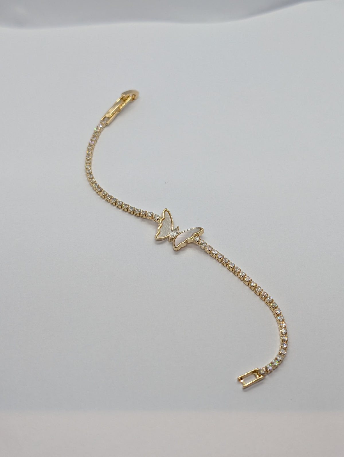Gold mother of pearl butterfly station CZ tennis bracelet on Zemora jewellery card