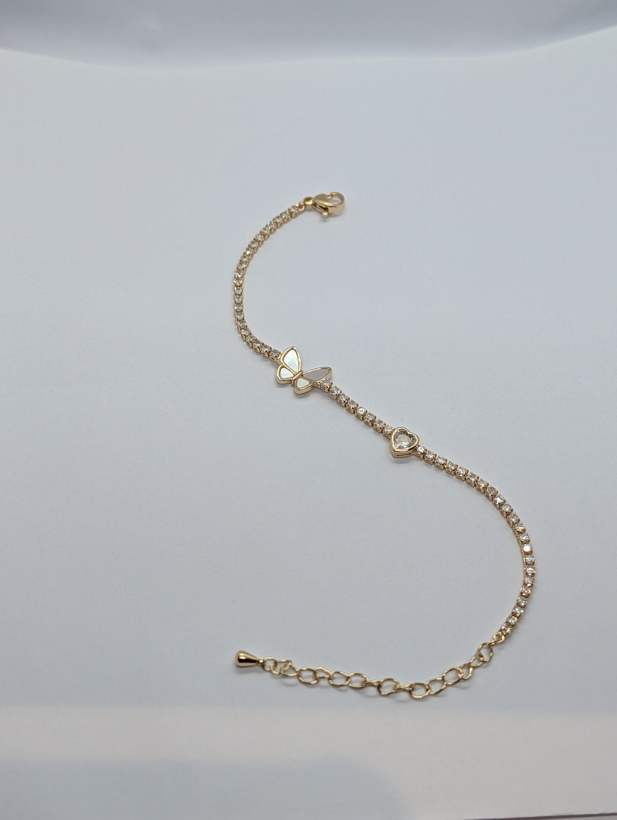 Gold butterfly heart duo station CZ tennis bracelet on Zemora jewellery card