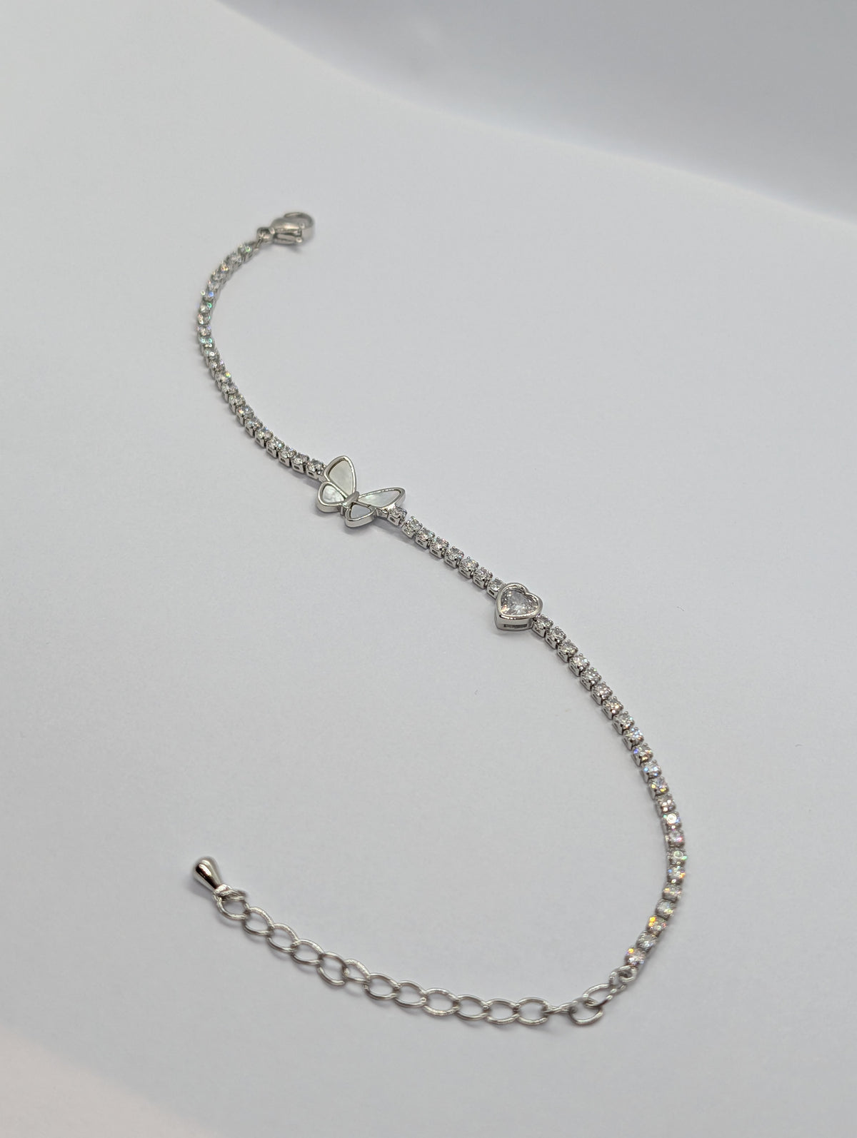 Rose gold butterfly heart duo station CZ tennis bracelet on Zemora jewellery card