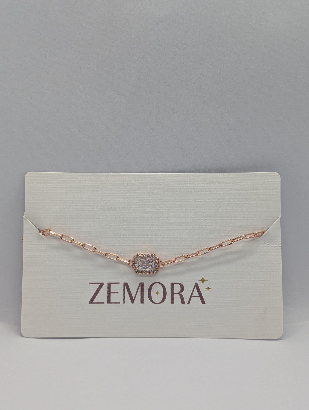 Emerald CZ Halo Rectangle Bracelet - Rose Gold tone with clear CZ on display card