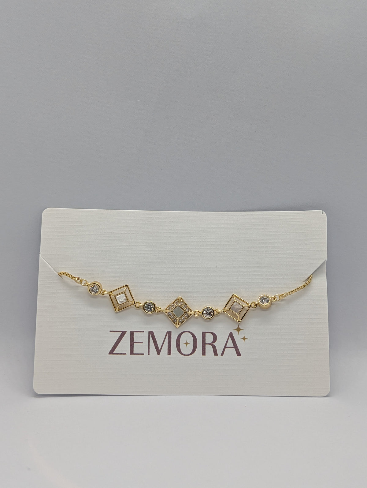 CZ Diamond Shape Station Bracelet - Gold tone on Zemora display card