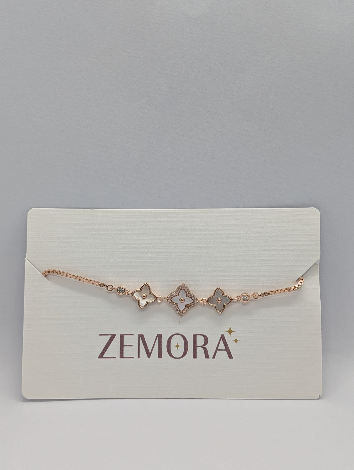 CZ Mother of Pearl Triple Flower Bracelet - Rose Gold tone front view on Zemora card display