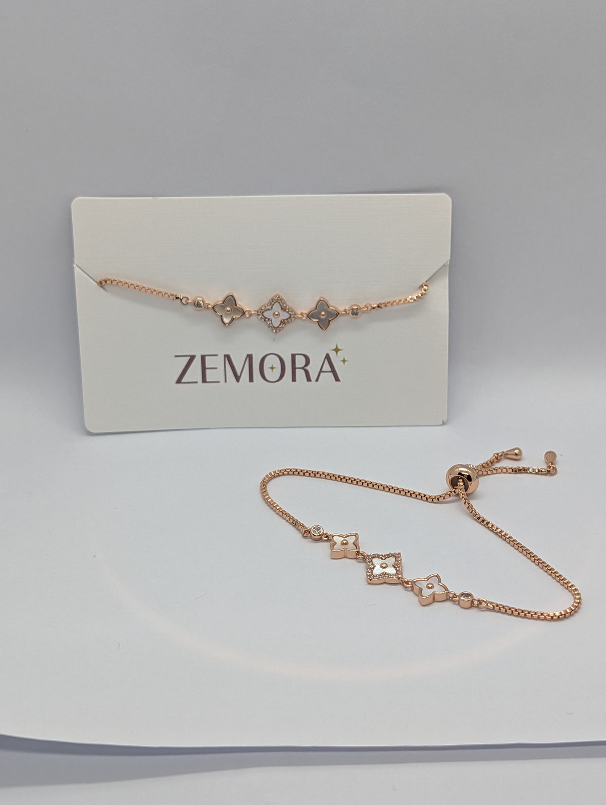 CZ Mother of Pearl Triple Flower Bracelet - Rose Gold tone full view with adjustable pull-cord and Zemora card