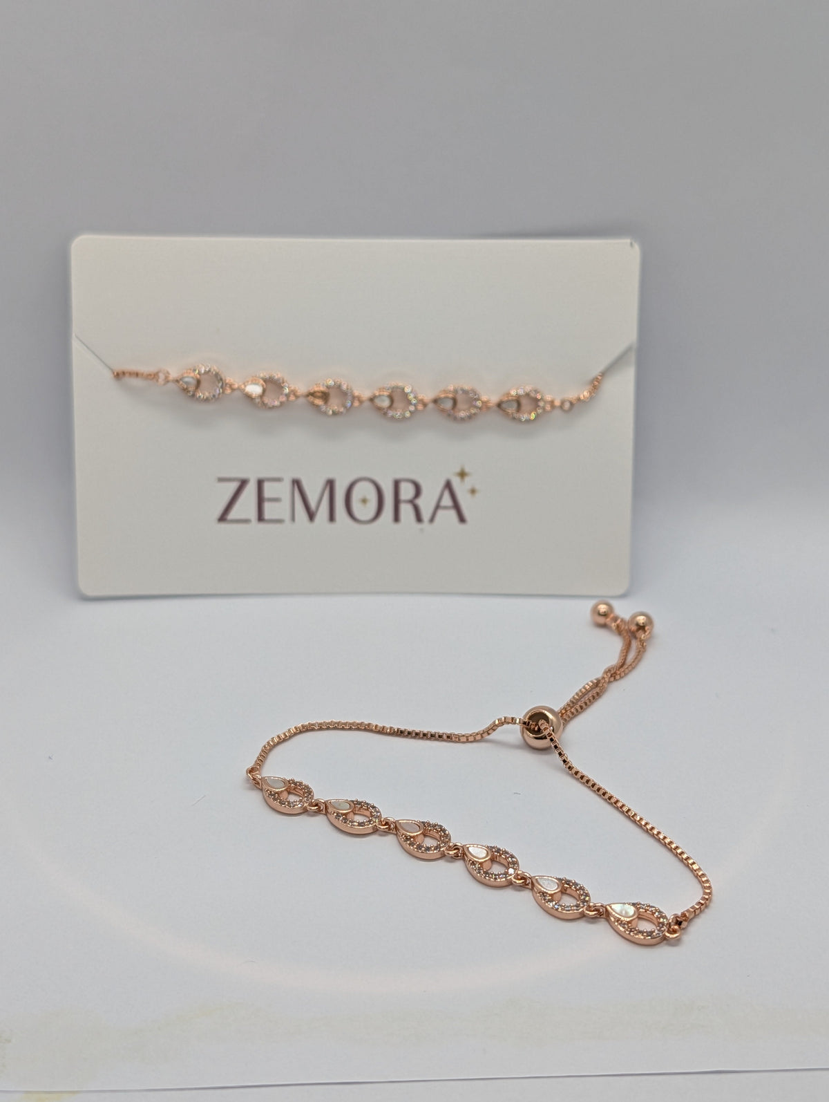 CZ Mother of Pearl Teardrop Link Bracelet - Rose Gold tone with pull-cord closure and Zemora card