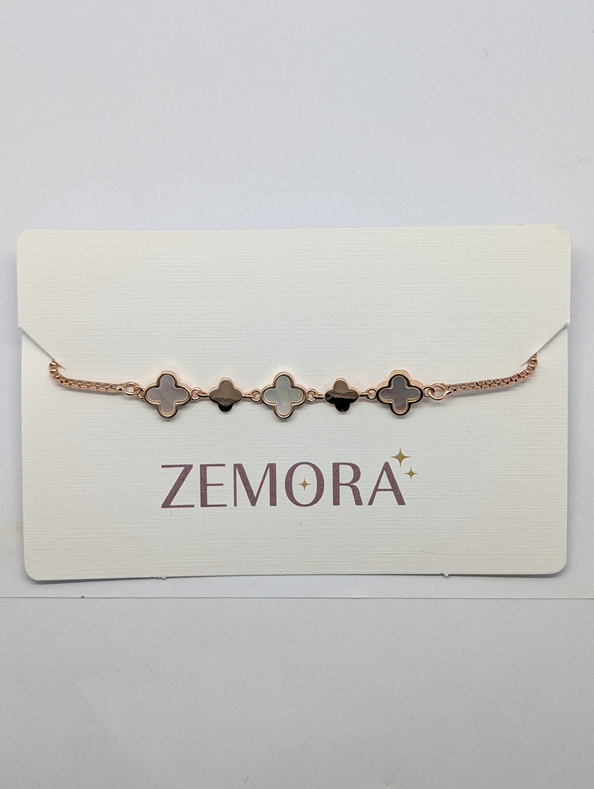 Mother of Pearl Onyx Alternating Clover Bracelet - Silver tone front view on Zemora card