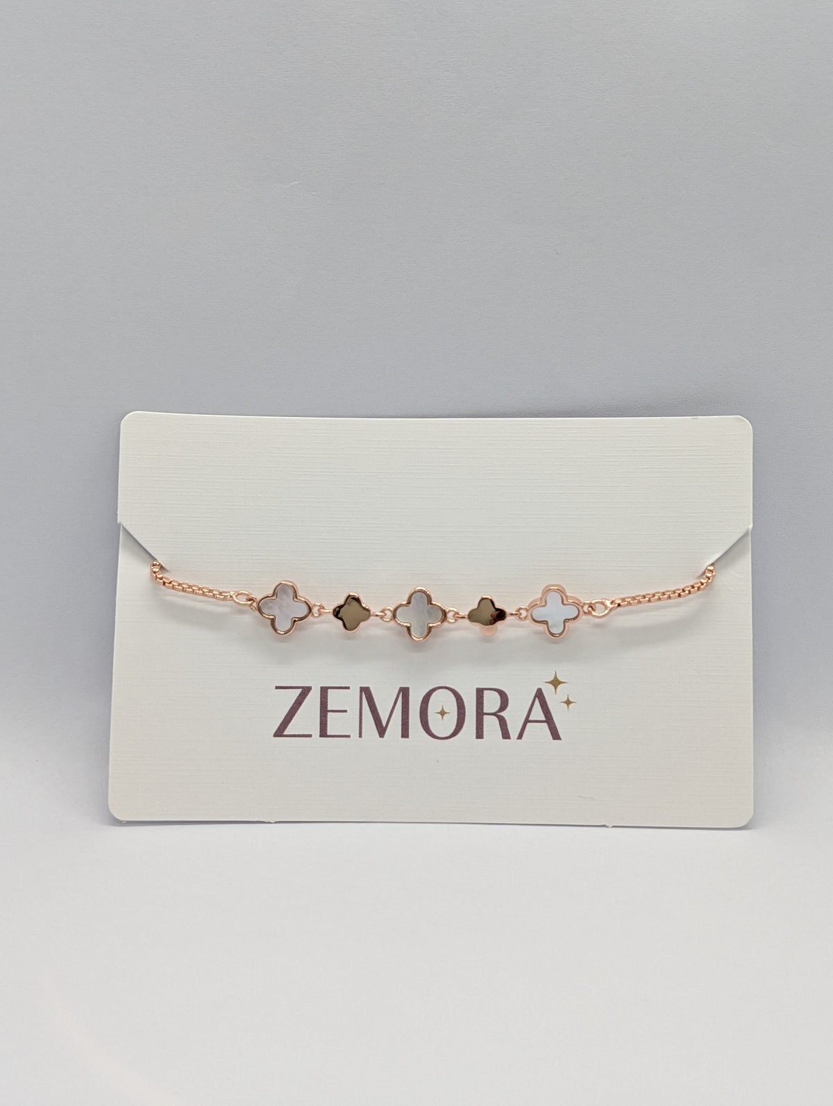Mother of Pearl Onyx Clover Station Bracelet - Silver tone angled view on Zemora card display