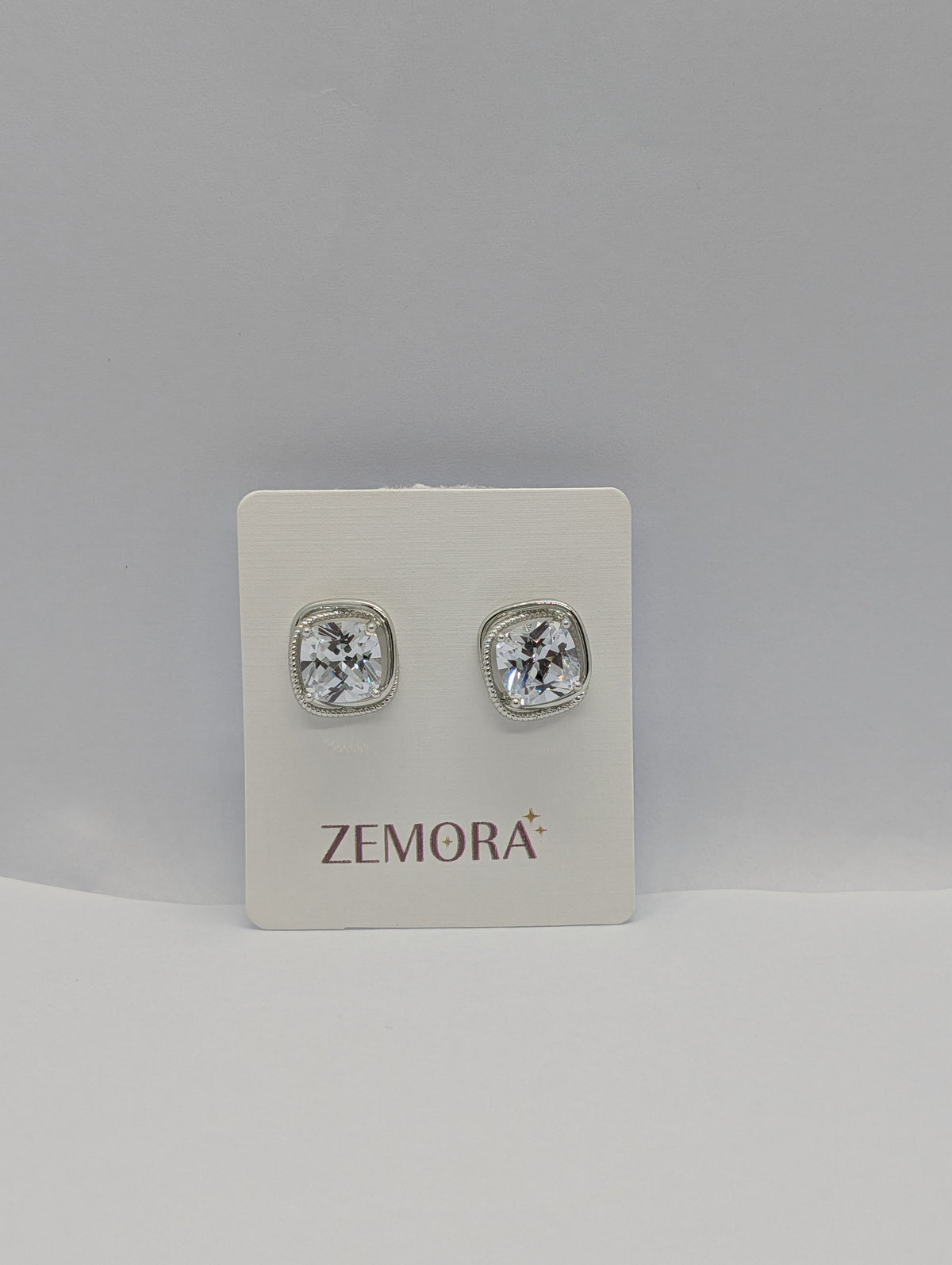 Cushion-Cut CZ Milgrain Stud Earrings - Silver tone on Zemora display card