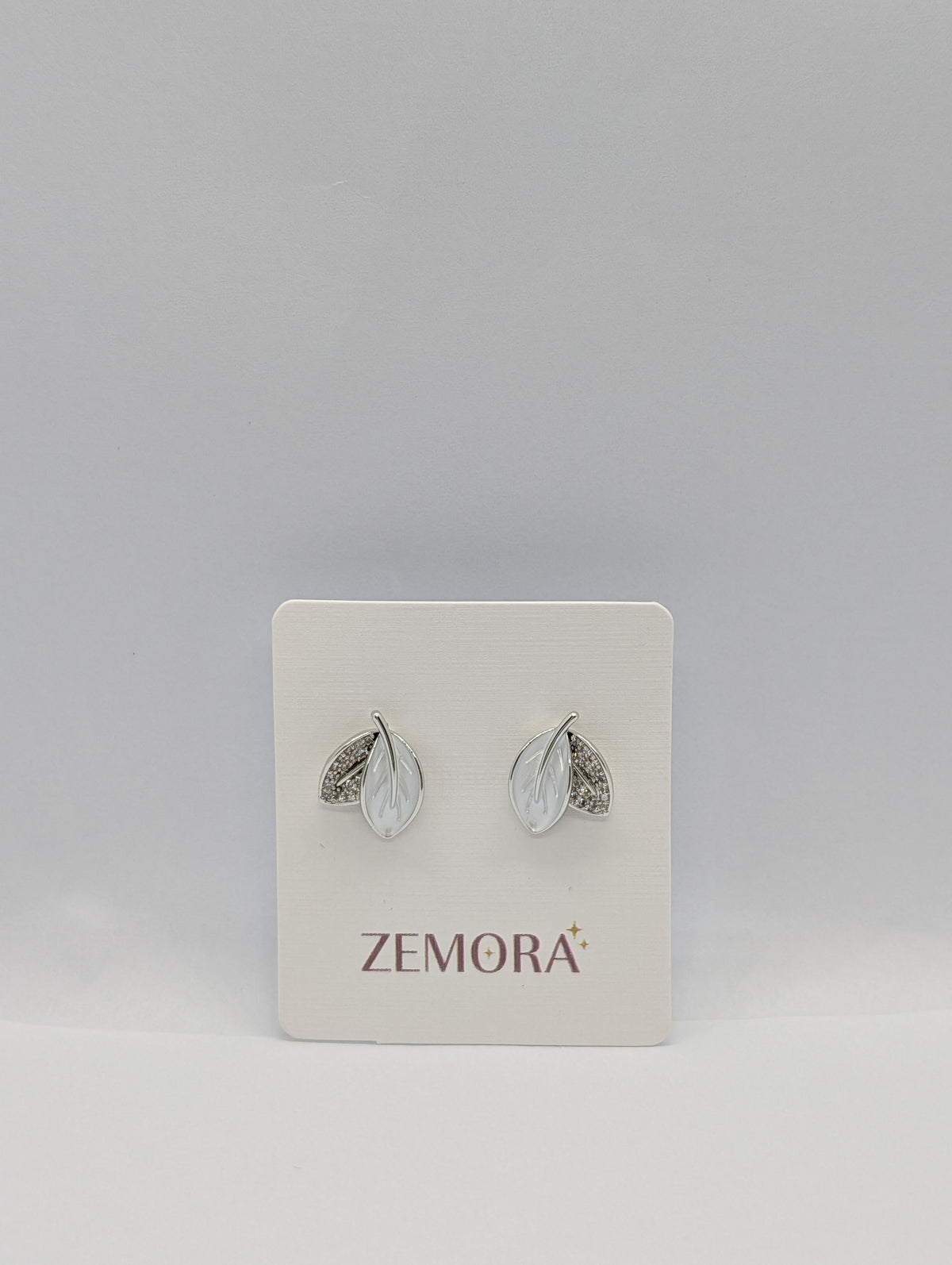 Mother of Pearl CZ Leaf Stud Earrings - Silver tone on Zemora display card