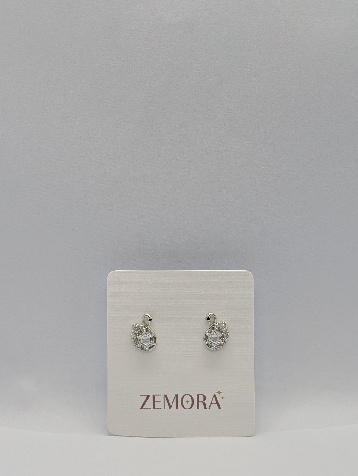 CZ Swan Stud Earrings - Silver tone on Zemora display card