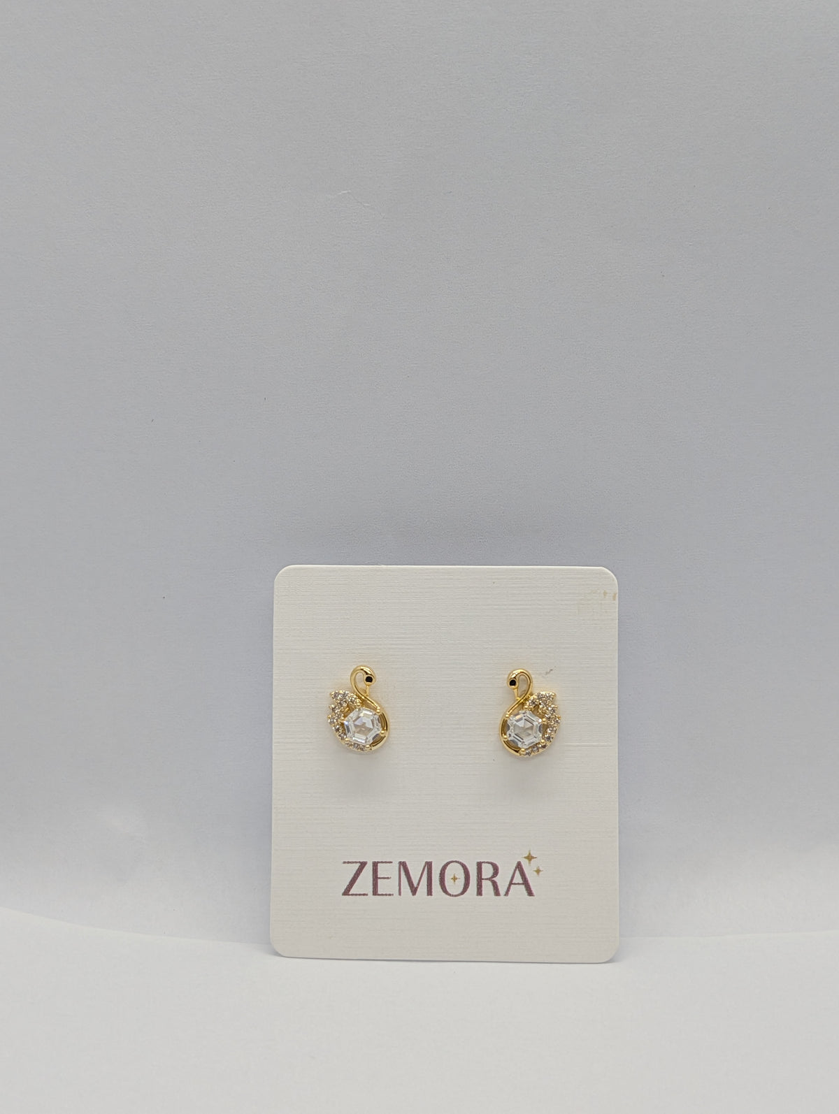 CZ Swan Stud Earrings - Gold tone on Zemora display card