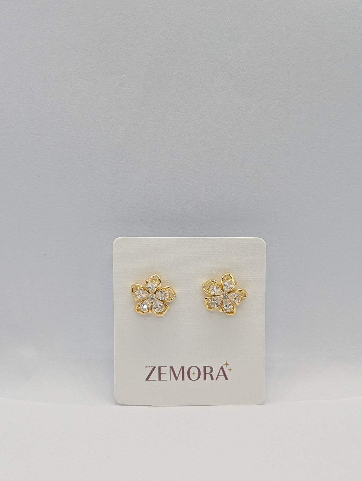 CZ Petal Flower Stud Earrings - Gold tone on Zemora display card
