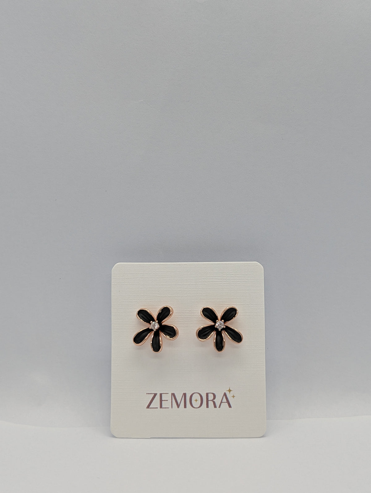 Black Enamel Daisy CZ Centre Stud Earrings - Rose Gold tone on Zemora display card