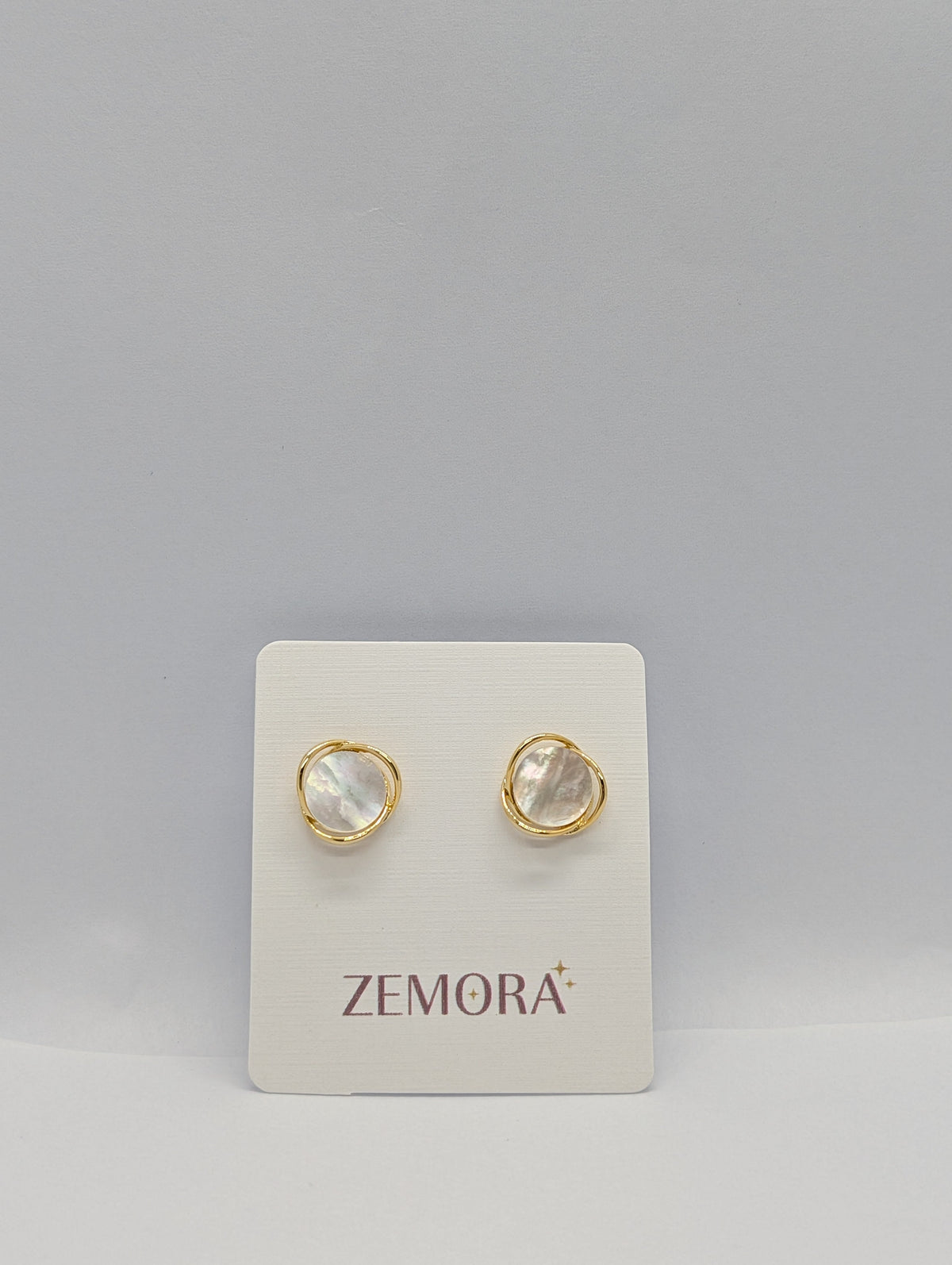 Mother of Pearl Wire Wrap Circle Stud Earrings - Gold tone pair on Zemora card display