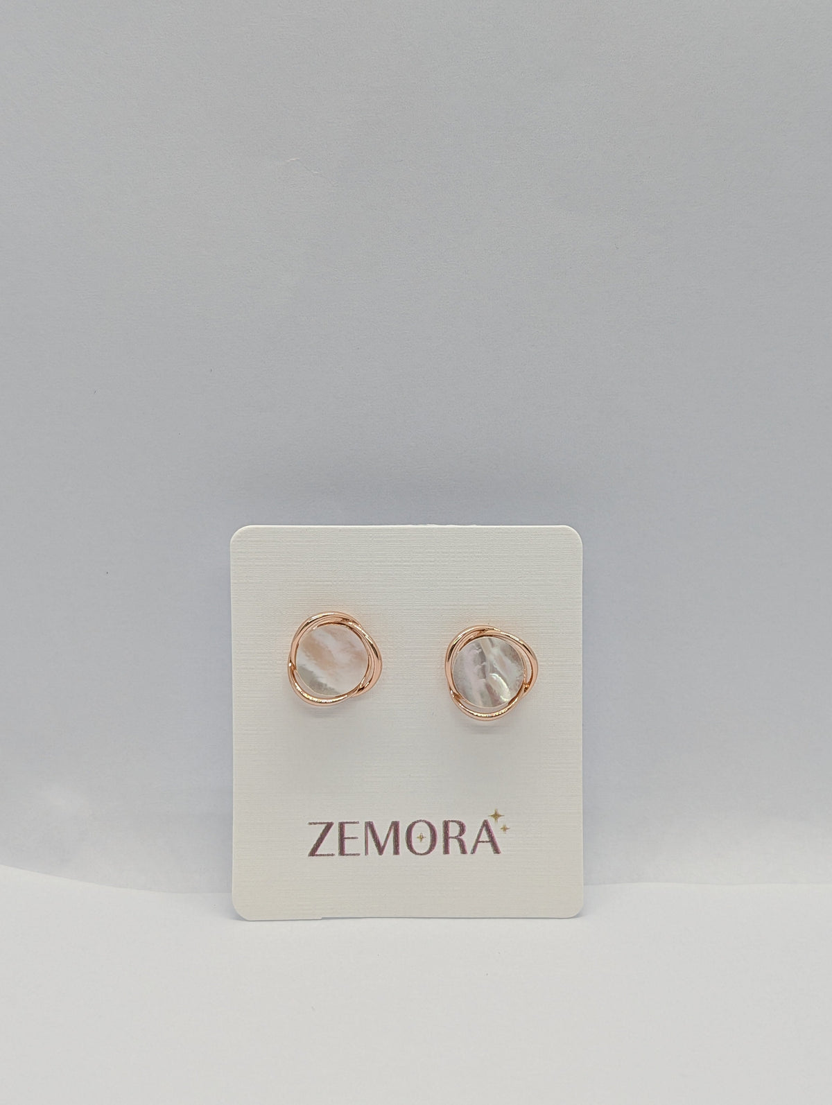 Mother of Pearl Wire Wrap Circle Stud Earrings - Rose Gold tone pair on Zemora card display