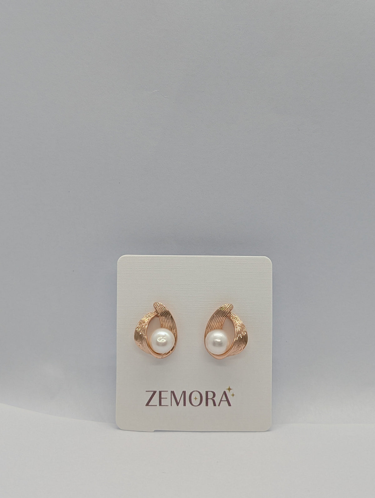Pearl Ribbed Wire Wrap Stud Earrings - Rose Gold tone pair on Zemora card display