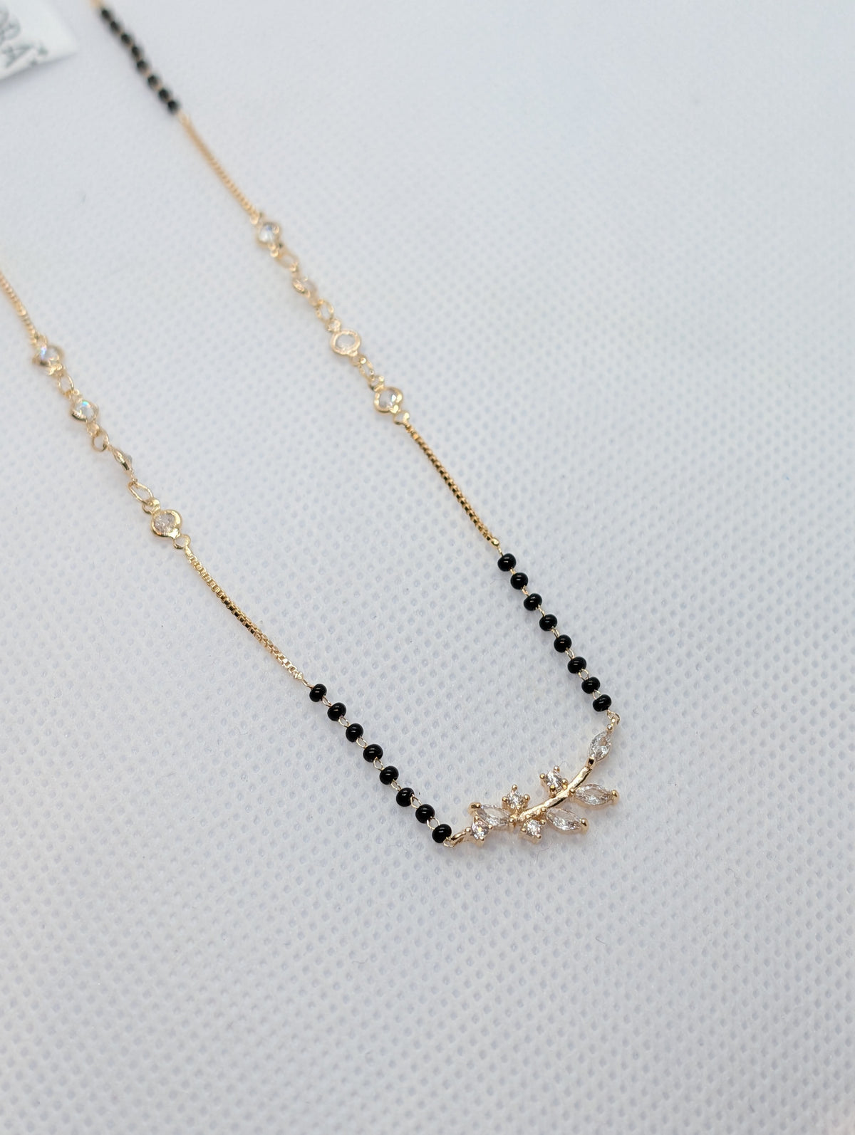 CZ Butterfly Mangalsutra - Gold tone pendant close up