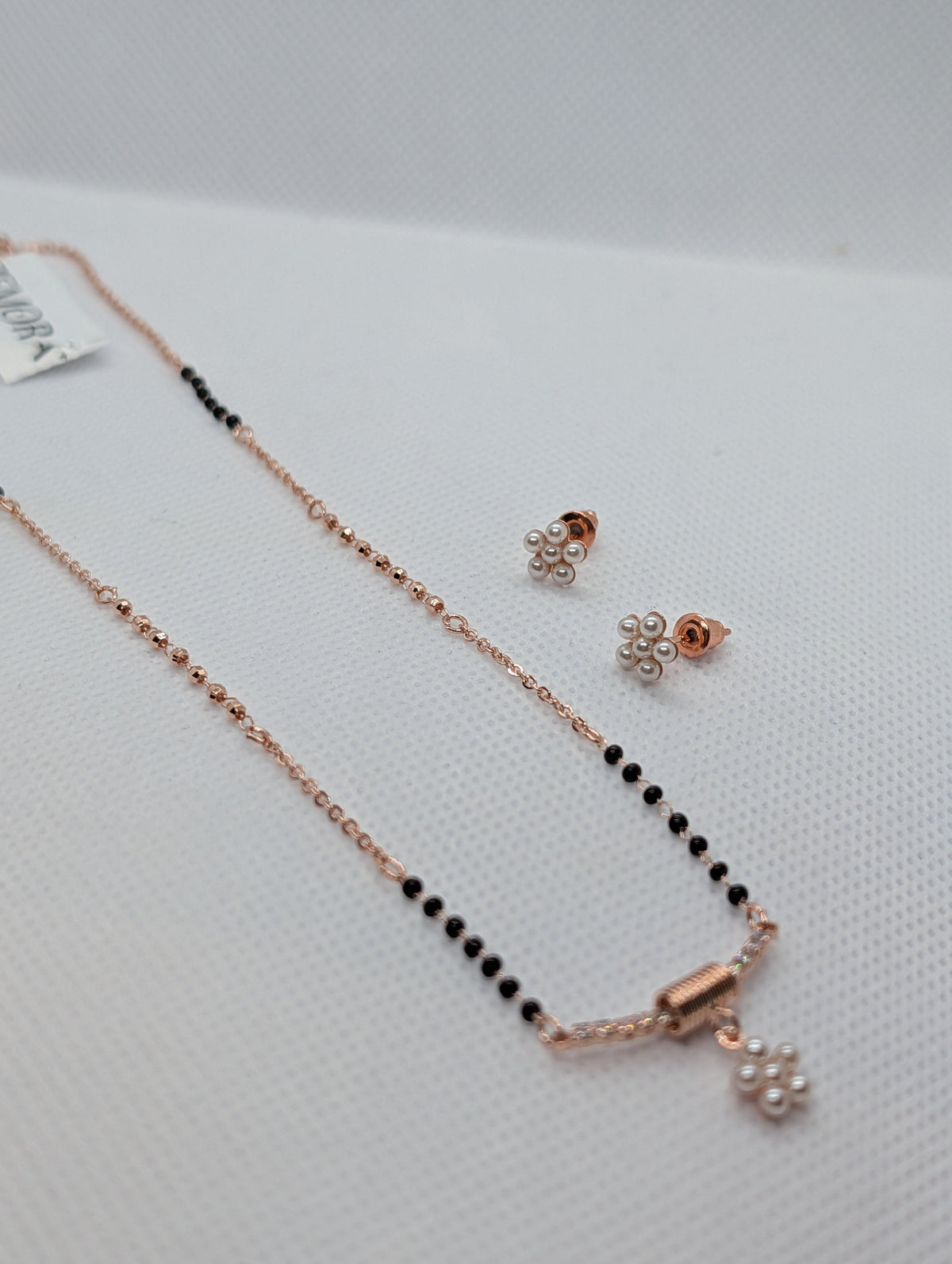 CZ Bar Pearl Flower Cluster Mangalsutra Set - Silver tone angle view with earrings