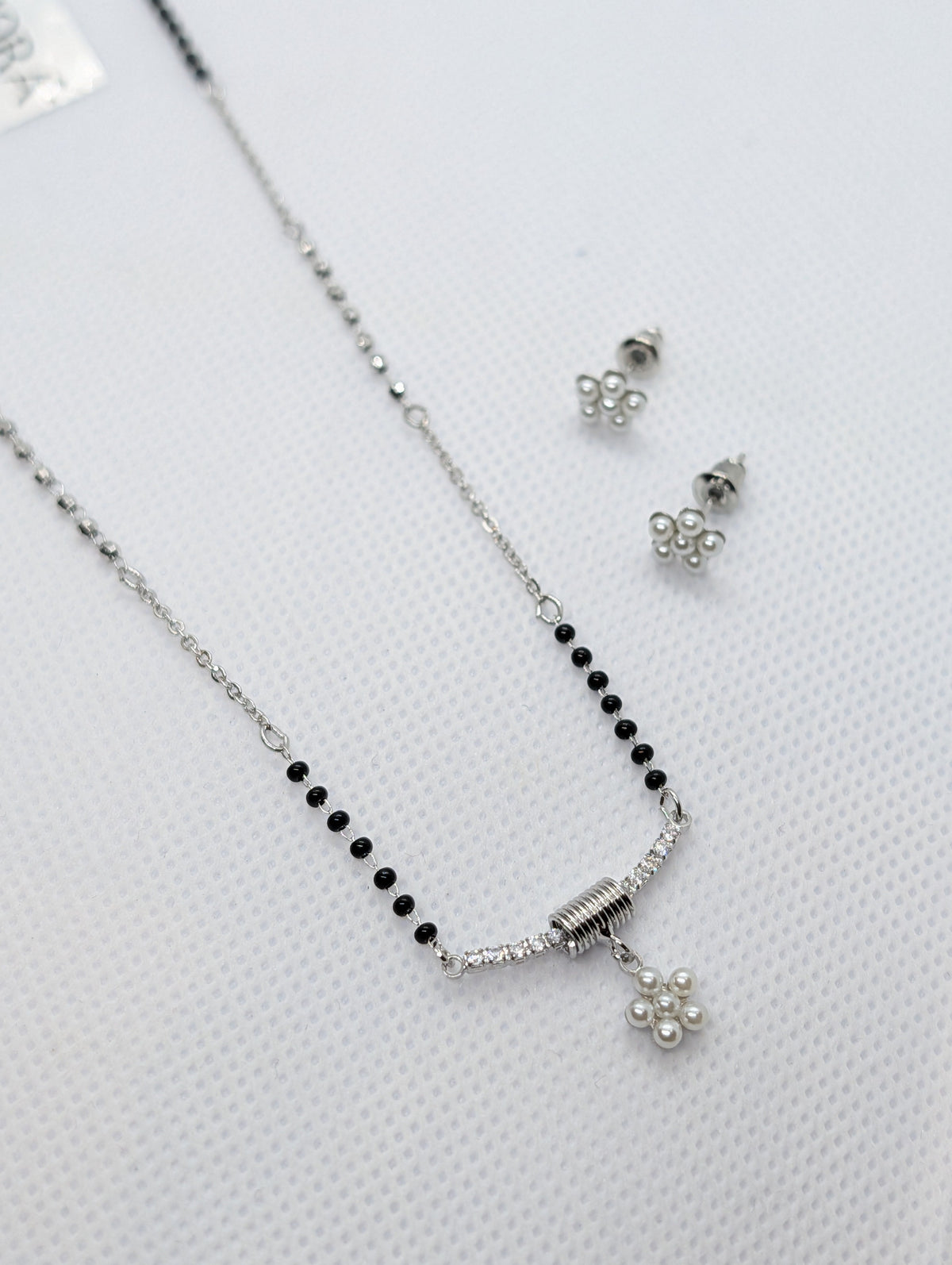 CZ Bar Pearl Flower Cluster Mangalsutra Set - Gold tone angle view with earrings