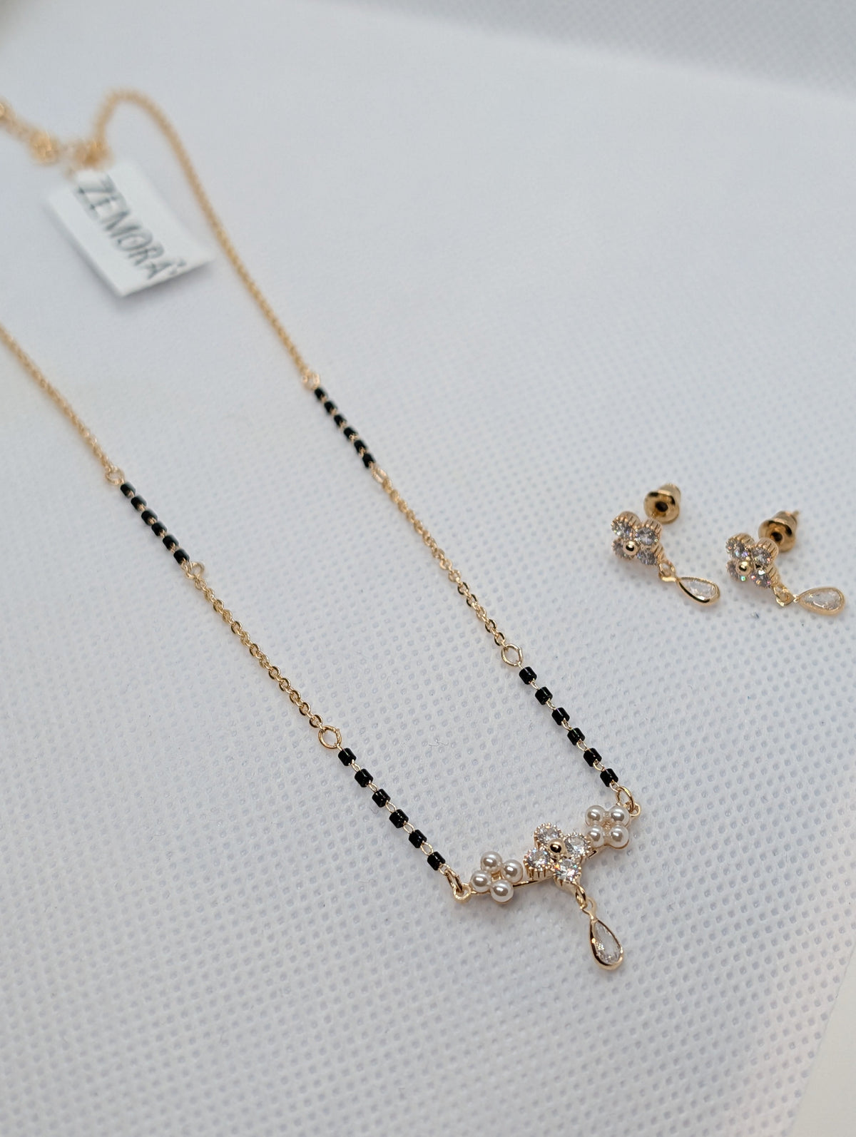 CZ Flower Pearl Cluster Drop Mangalsutra Set - Rose Gold tone earrings and pendant close up