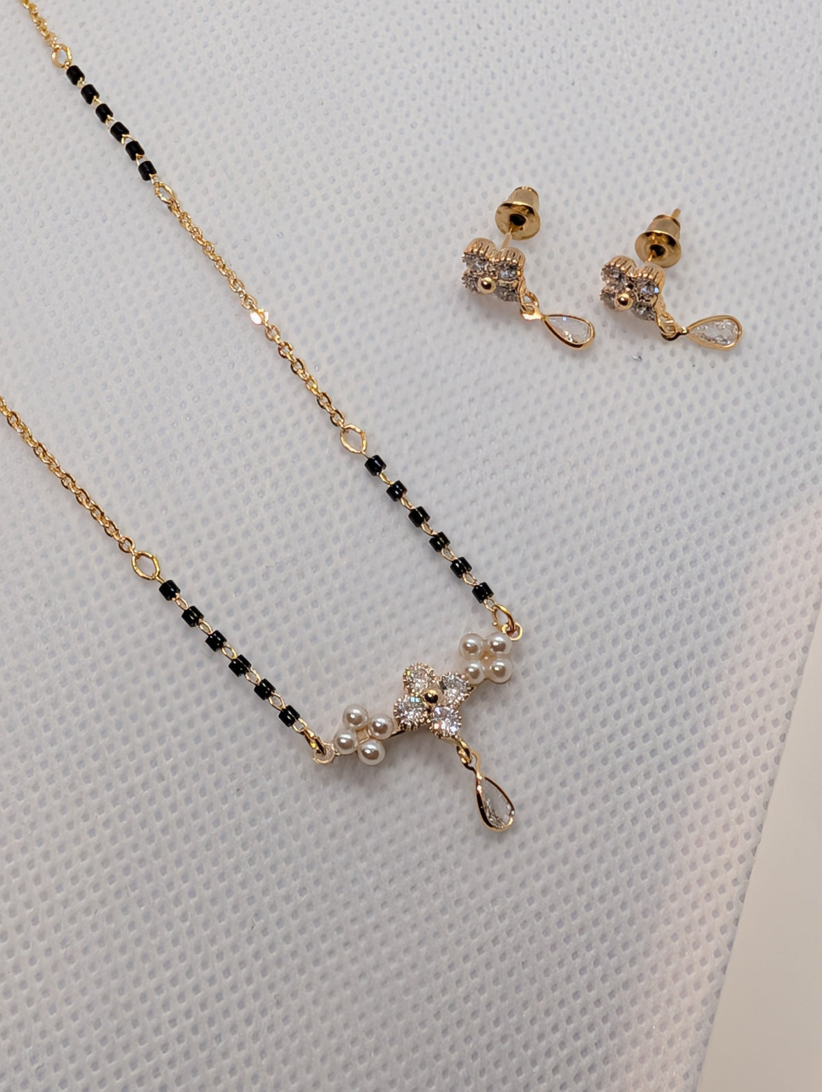 CZ Flower Pearl Cluster Drop Mangalsutra Set - Rose Gold tone full length flat lay