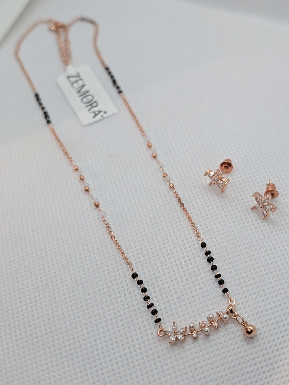 CZ Star Flower Pearl Mangalsutra Set - Rose Gold tone full view with earrings on Zemora card