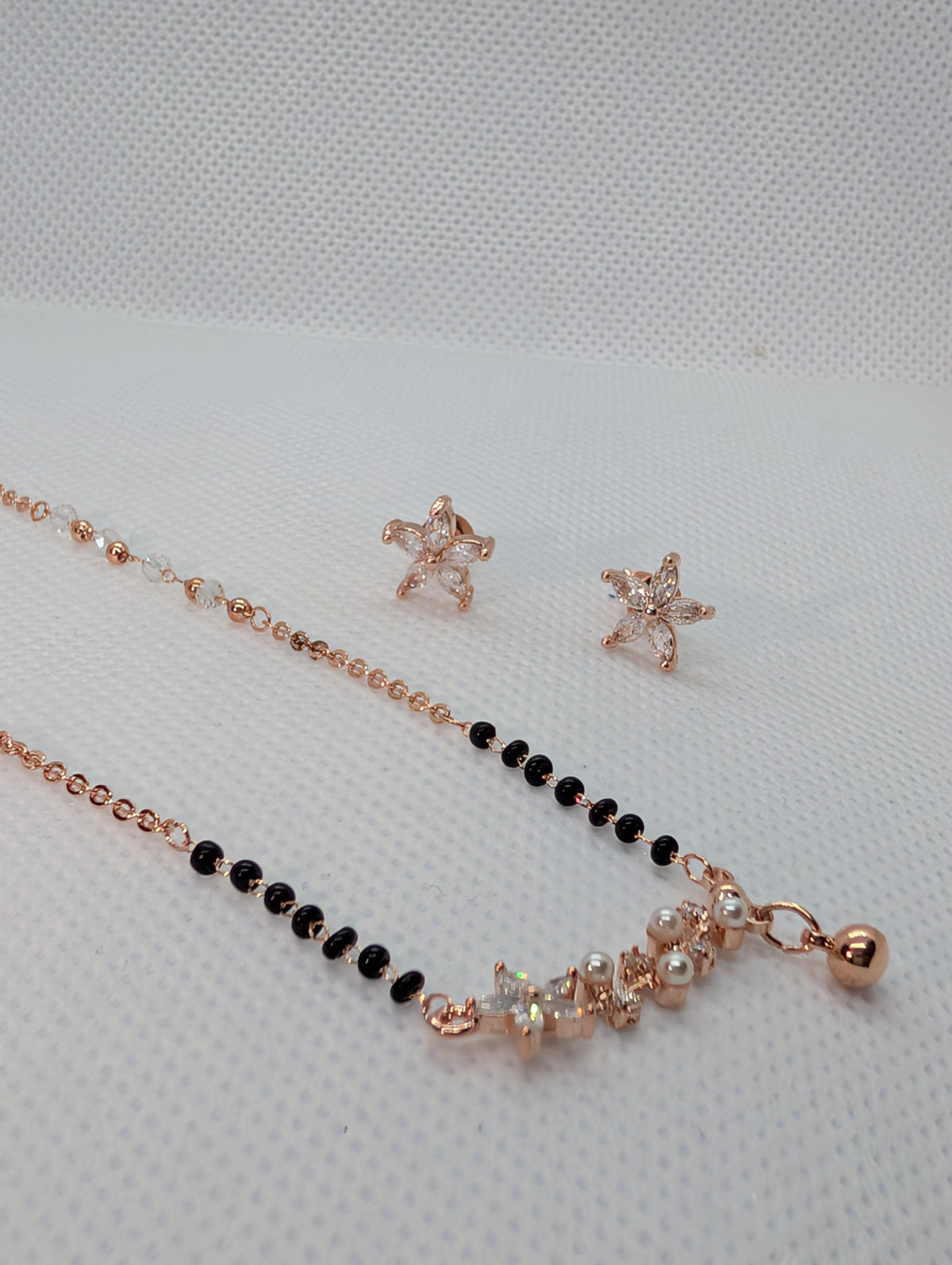 CZ Star Flower Pearl Mangalsutra Set - Rose Gold tone pendant and earrings close up