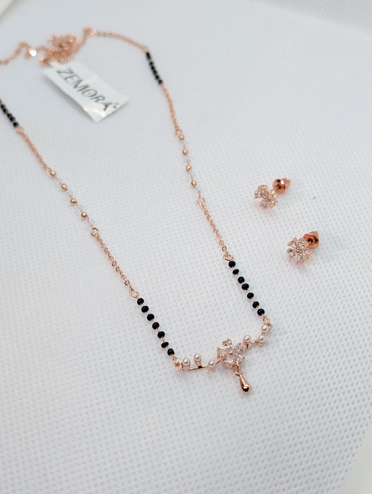CZ Marquise Flower Pearl Drop Mangalsutra Set - Rose Gold tone full view with earrings on Zemora card