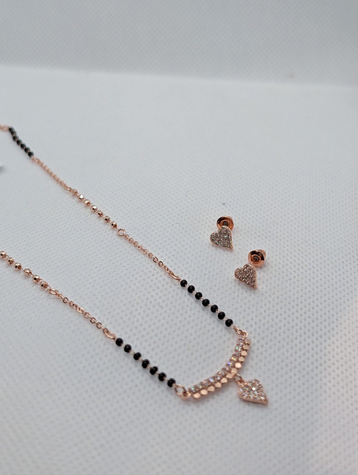 CZ Pave Bar Heart Drop Mangalsutra Set - Rose Gold tone pendant and earrings close up