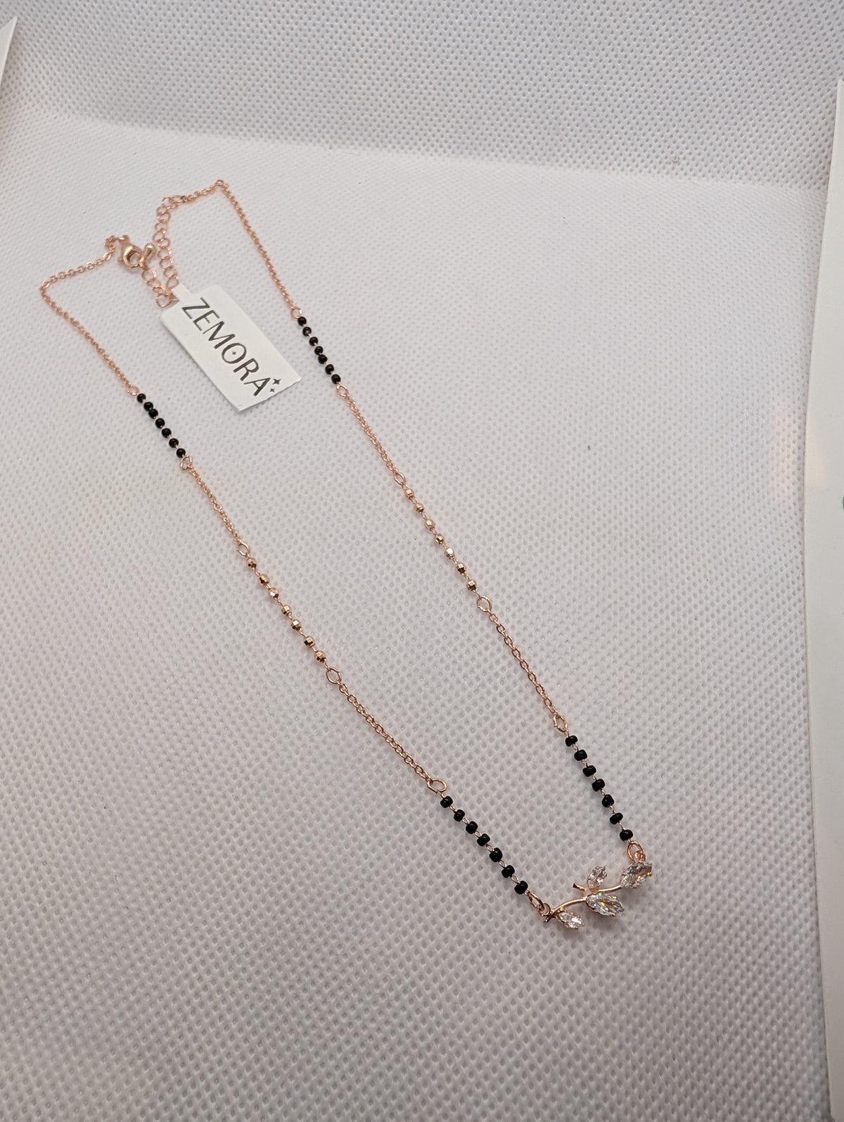 CZ Marquise Leaf Branch Mangalsutra - Rose Gold tone full length flat lay angled with Zemora tag