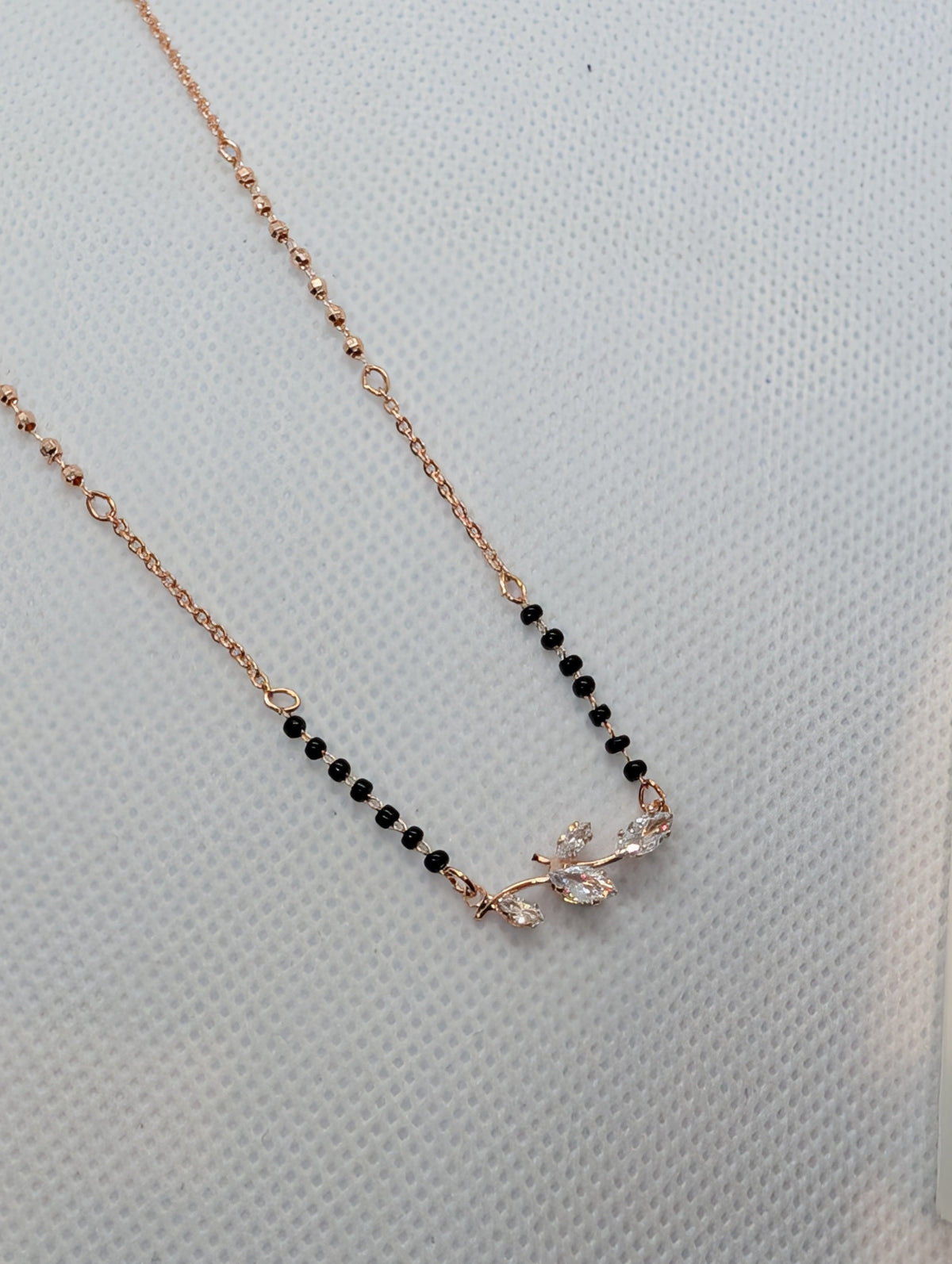 CZ Marquise Leaf Branch Mangalsutra - Gold tone full length with Zemora tag on display stand