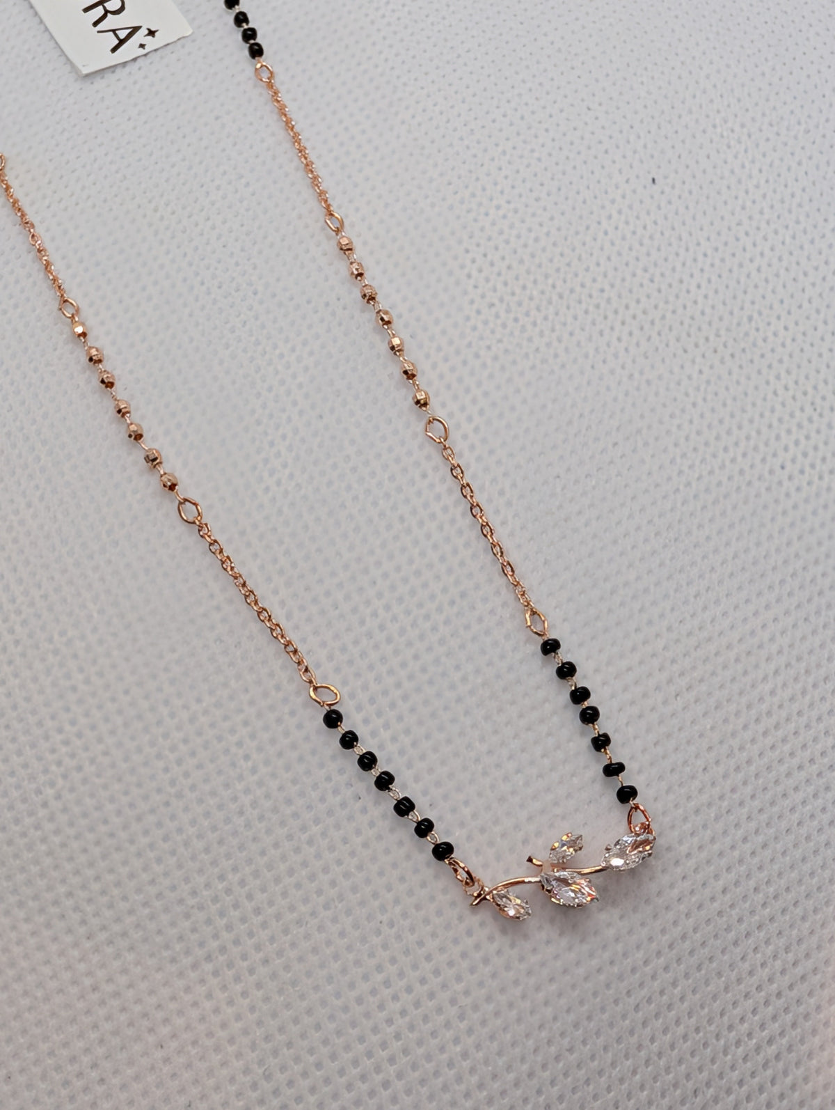 CZ Marquise Leaf Branch Mangalsutra - Gold tone flat lay with Zemora tag angle view