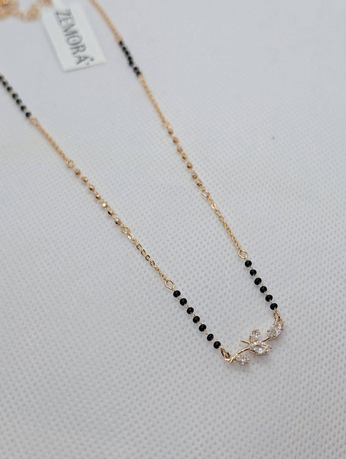 CZ Marquise Leaf Branch Mangalsutra - Rose Gold tone full length flat lay with Zemora tag
