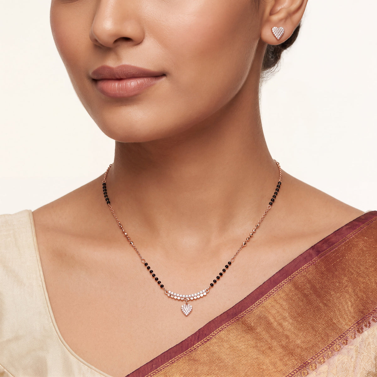 CZ Pave Bar Heart Drop Mangalsutra Set - Rose Gold tone worn on model with saree